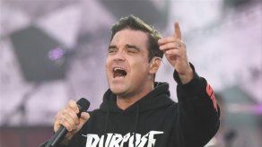 Robbie Williams pone la música a todo volumen para atormentar a Jimmy Page