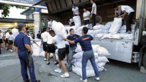 Suben a 418 los cadáveres recuperados tras el tifón Bopha en Filipinas