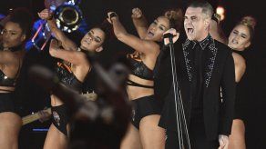 Robbie Williams y Black Eyed Peas participarán en concierto en Mánchester