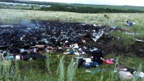 Casi 200 cadáveres del avión malasio aguardan en un tren su identificación