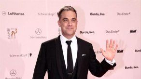 Robbie Williams quiere volver a cantar con su padre