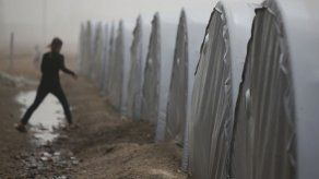 Curdos luchan para defender pueblo sirio sitiado