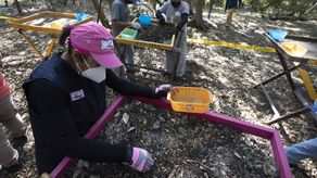 : “Zona E, Punto 53, I Cuadrante. Fragmentos de restos óseos con exposición al fuego”.