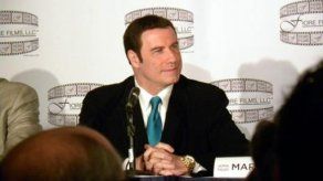 Diario dice que Travolta intentó que masajista retirara demanda