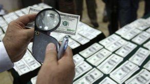 Peruanos artistas de la falsificación de dólares