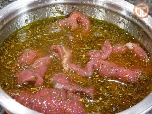 Res en salsa picante