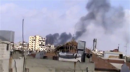 Activistas: Aviones sirios atacan Homs